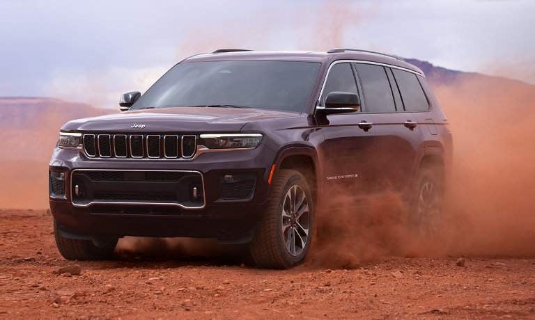 2022 Grand Cherokee L driving in red dust